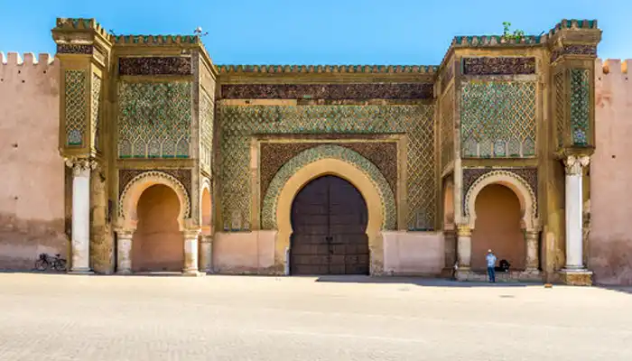 Bab Mansour gate in Meknes, Morocco, showcasing its grand design, towering arches, and historic significance.