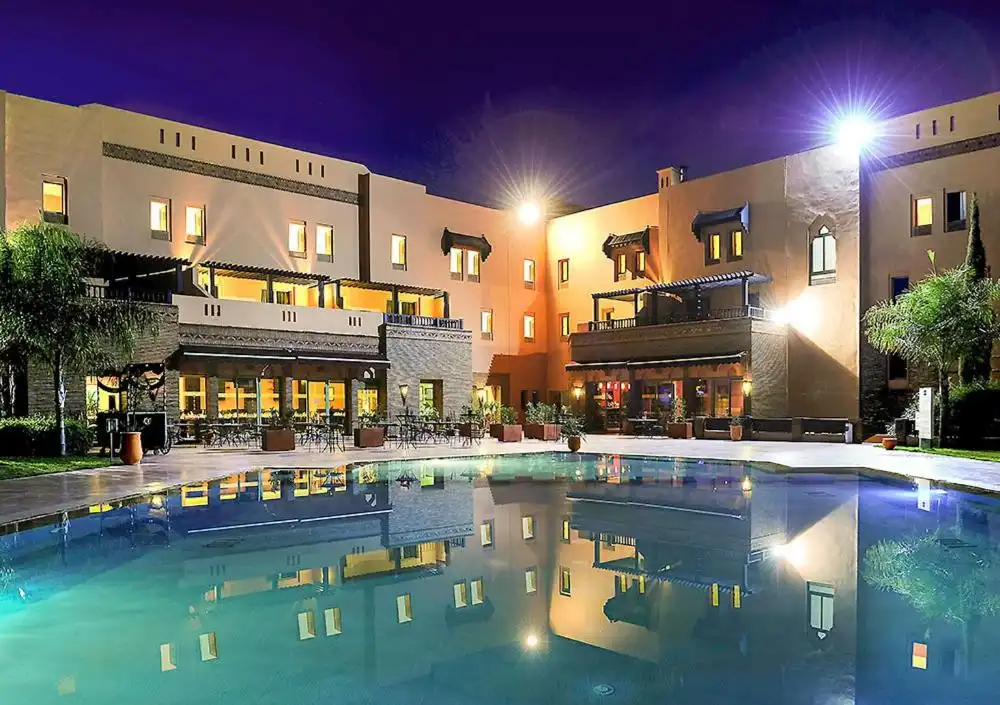 Contemporary Ibis Marrakech Moussafir with modern amenities and outdoor pool.