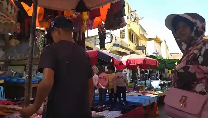 Souk Bab el-Jdid in Meknes, showcasing a variety of musical instruments, vintage goods, and traditional Moroccan items, reflecting the souk’s eclectic and vibrant character.