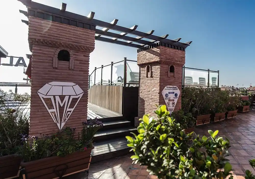 Modern Hotel Almas in Marrakech featuring a rooftop terrace and city views.